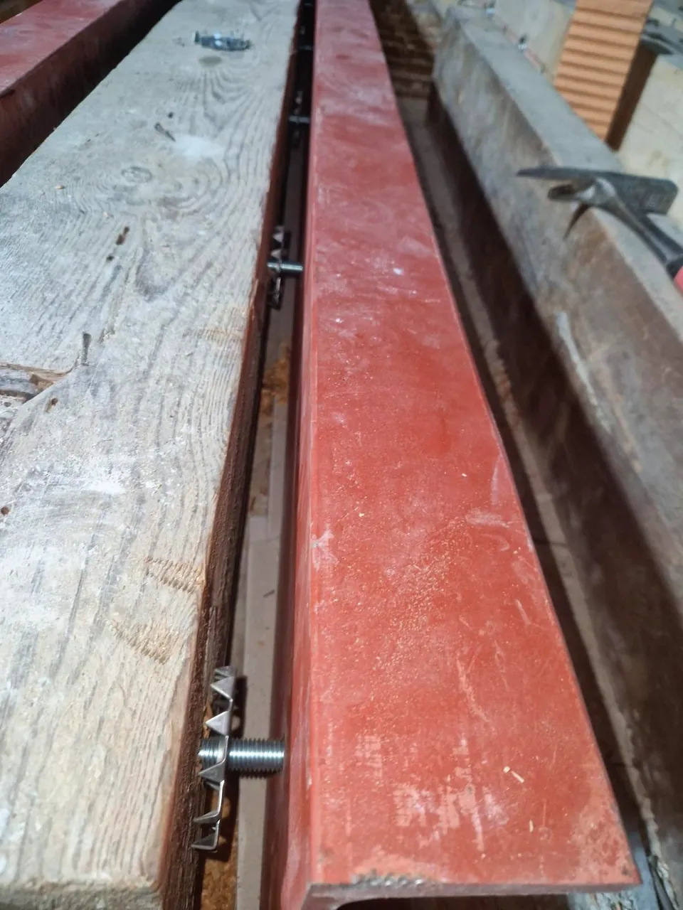 Detail: joint between steel section and timber joist